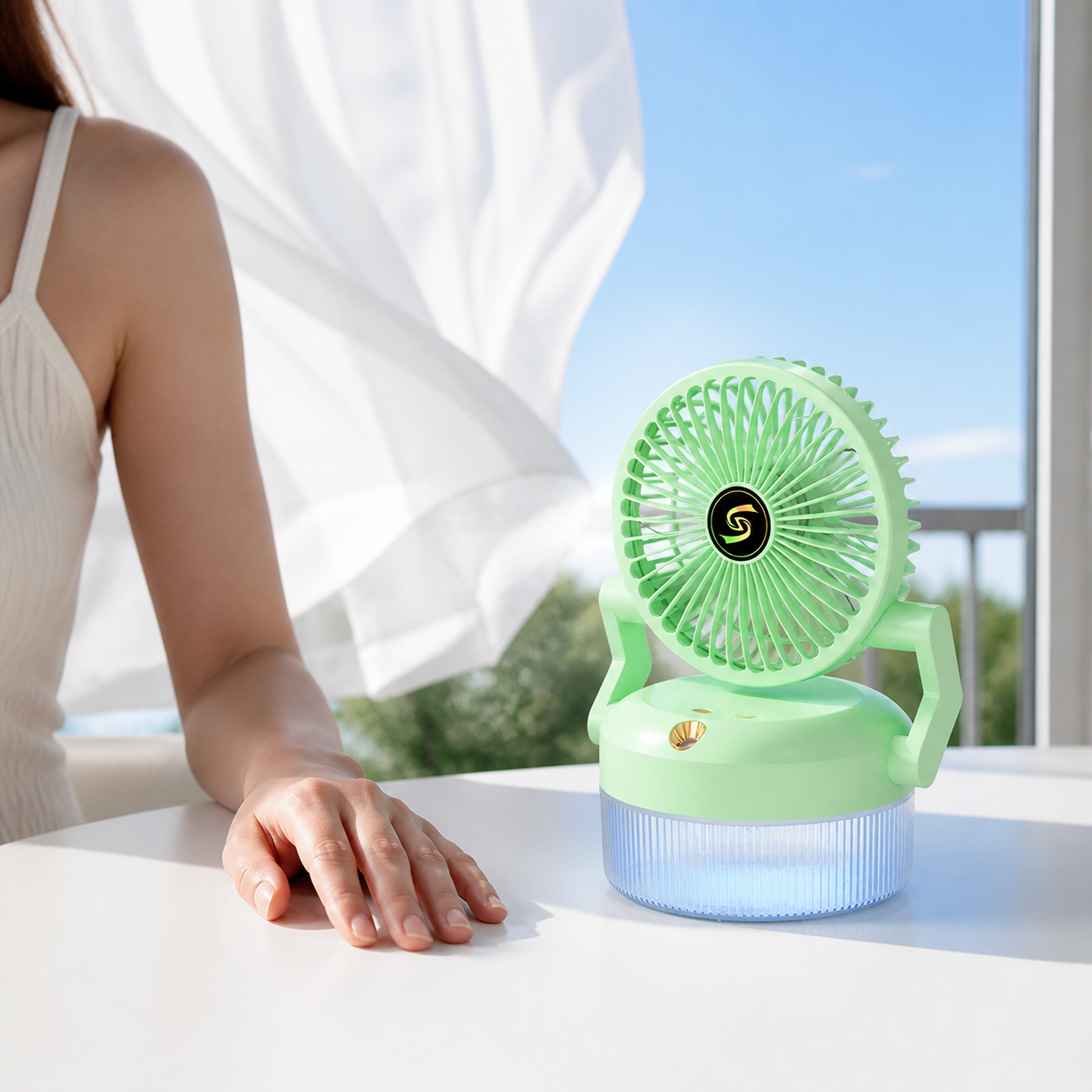 Freddova Aura desk fan and cooler used beside a woman at a bright table